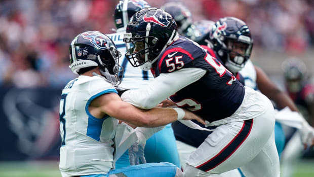 Tennessee Titans quarterback Will Levis (8) fumbles the ball on a sack by Houston Texans defensive end Jerry Hughes (55) during the second quarter at NRG Stadium in Houston, Texas., Sunday, Dec. 31, 2023. The ball was recovered by Texans defensive tackle Sheldon Rankins for a touchdown.